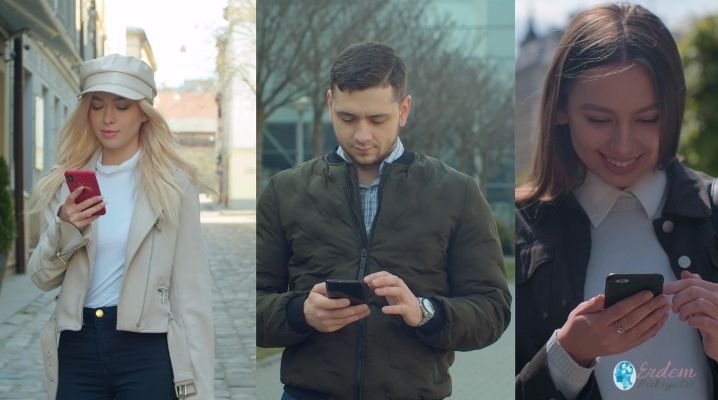 Nomofobi olan kadın ve erkekler elinde telefon yürüyor